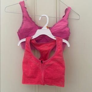 Two pink leisure / sports bras